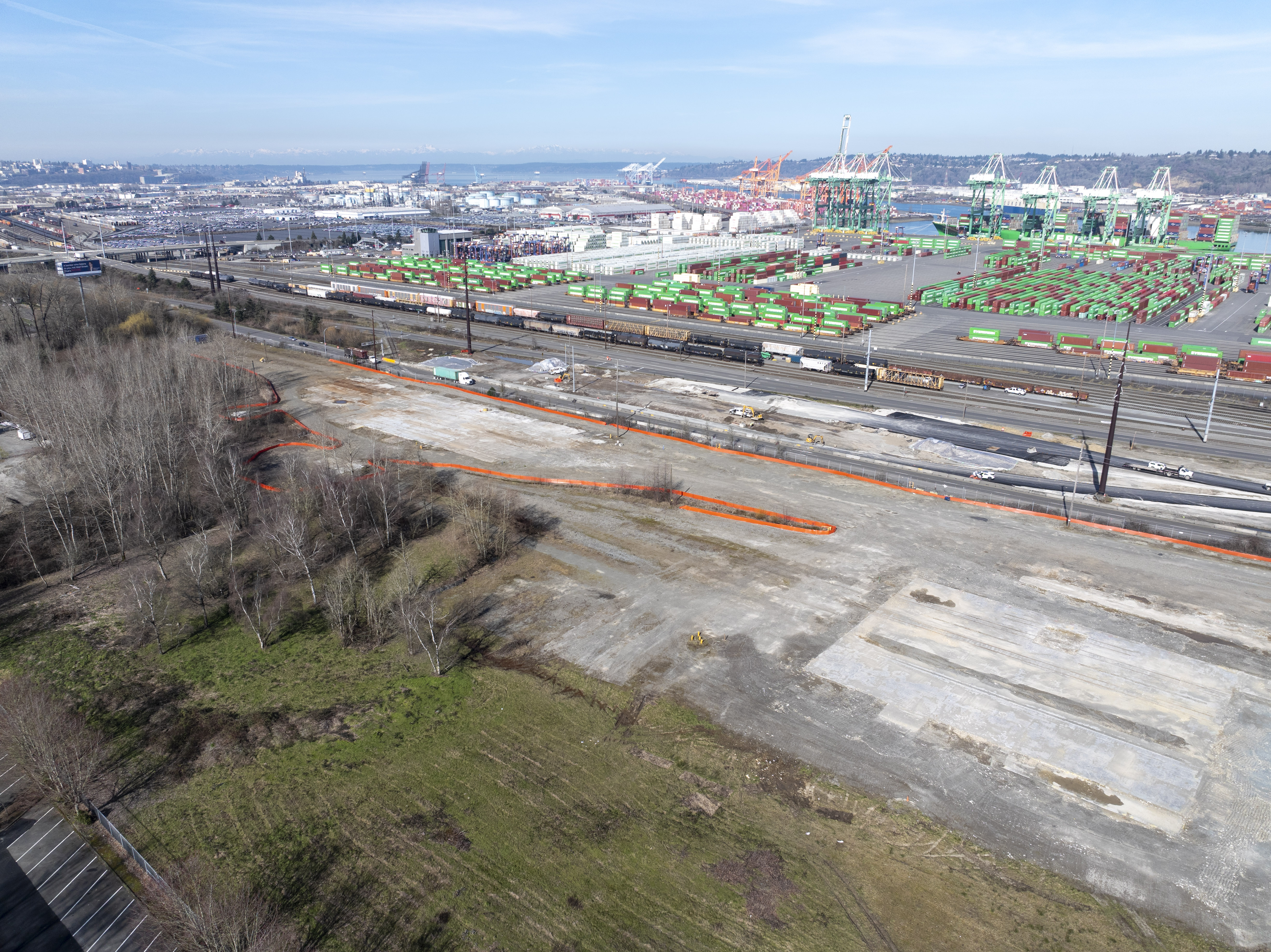 Aerial photo of vacant land near a Port terminal on a sunny day.