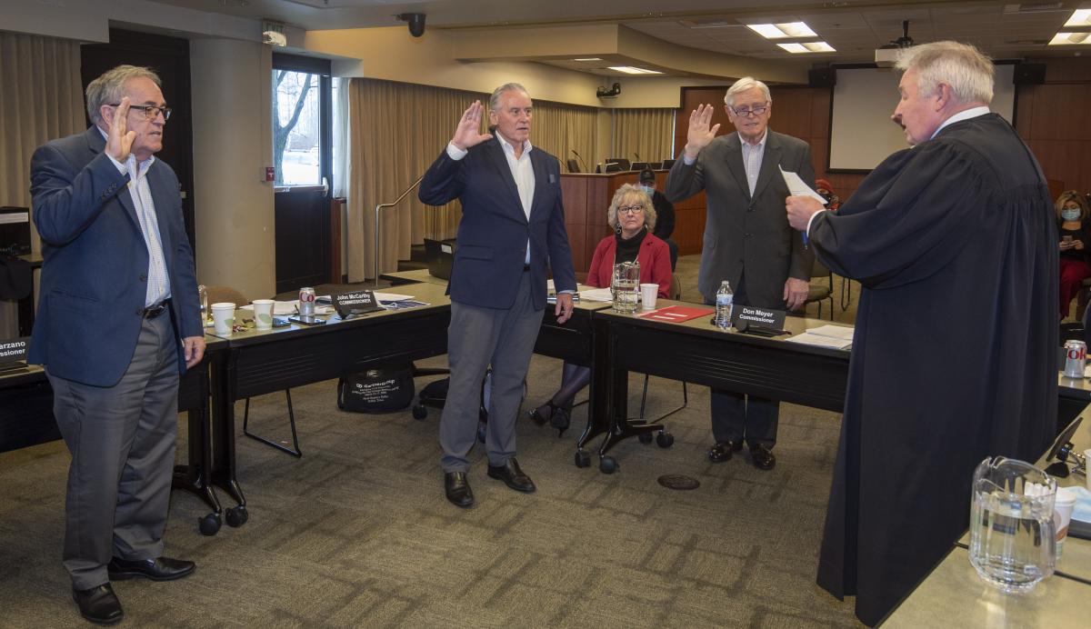 Commissioners swear in at the January commission meeting. 